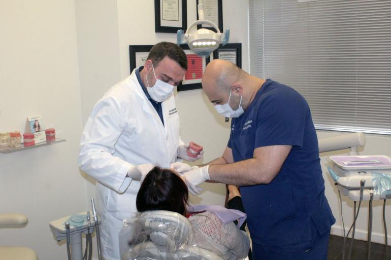 Dr. Kanaan and Dr. Samo discussing a patient case