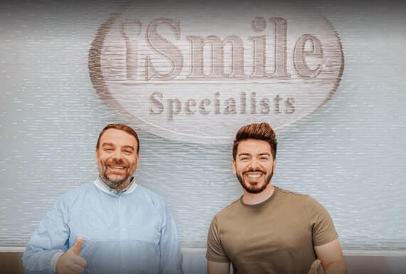 Orthodontist Dr. Wael Kanaan with a successful braces patient in Sugar Land, TX