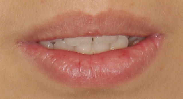 little display of upper teeth