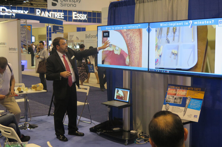 Orthodontist Dr. Kanaan at AAO convention giving a presentation on TADS